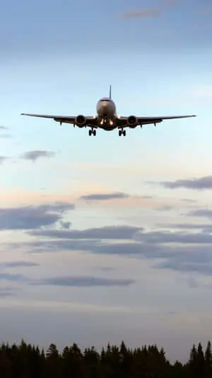 Airplane Flying Above Background