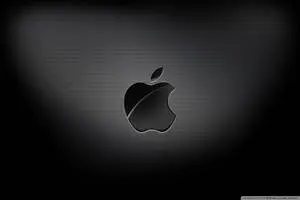 Intriguing display of Apple Logo in 4k resolution on a black carbon texture.