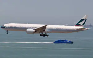 Cathay Pacific Plane And Blue Ship