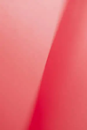 a close up of a pink paper